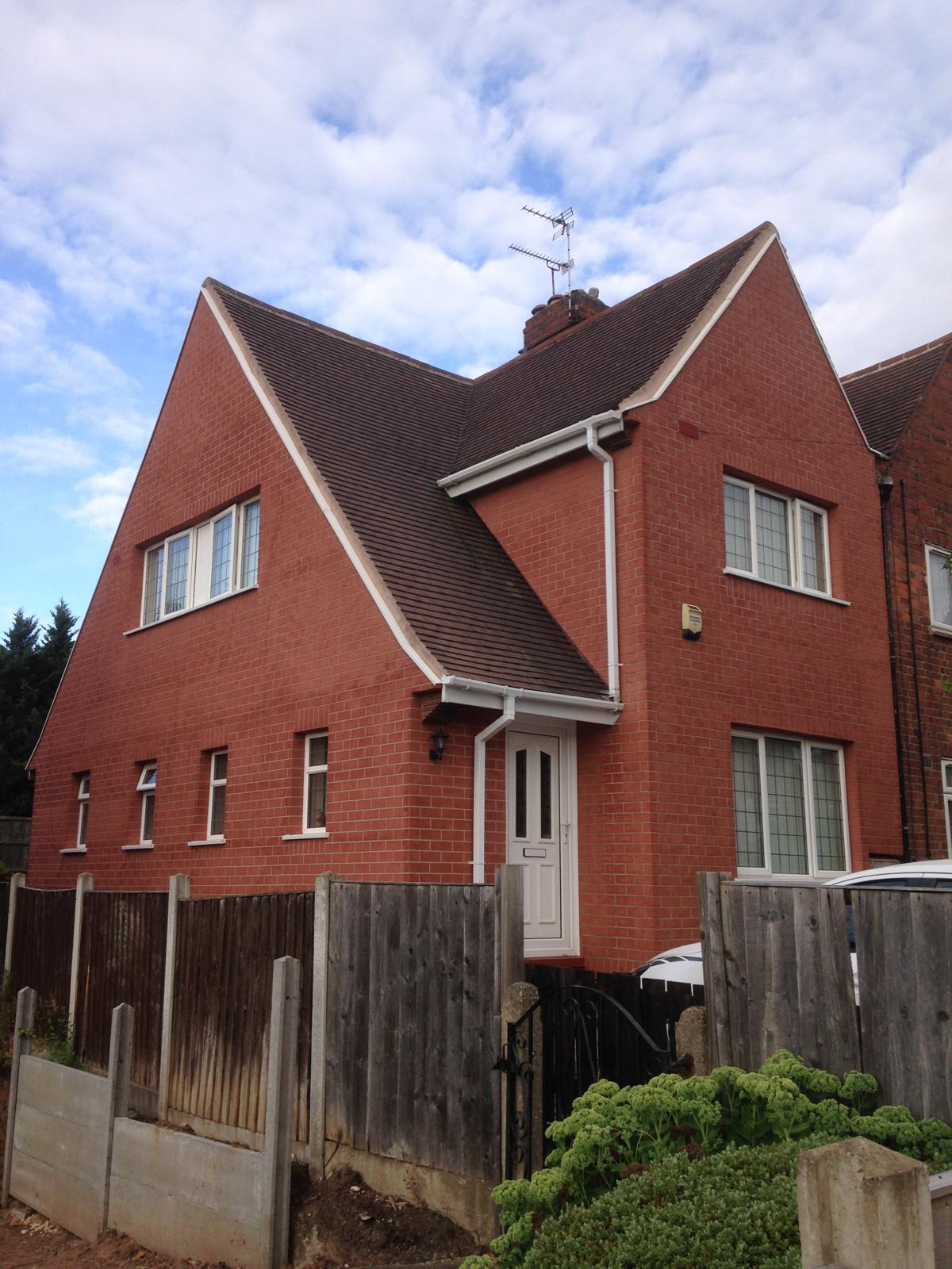 Brick-effect render finish on a period property — preserves traditional kerb appeal