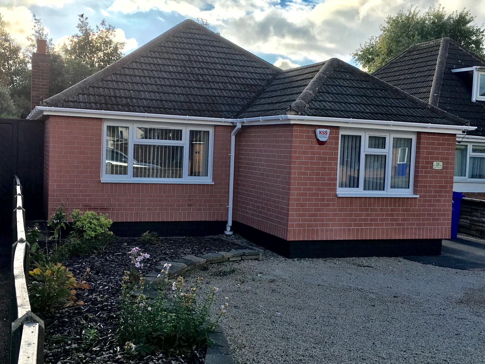 Brick-effect render finish on a period property — preserves traditional kerb appeal